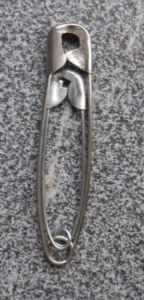 Large paperclip with medium paperclip inside it