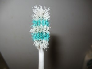 Worn toothbrush from the top.